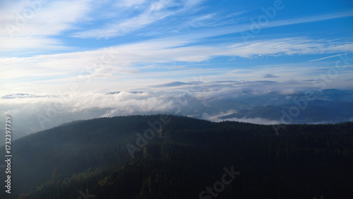 Beautiful view of the Beskydy Mountains in the Czech Republic covered in morning fog, a scenic and tranquil landscape of Bečva valley