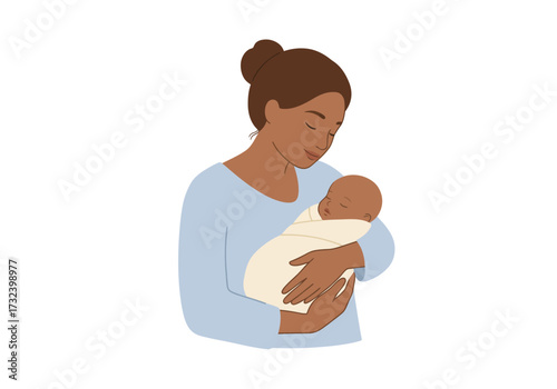 A woman holding a baby wrapped in a blanket