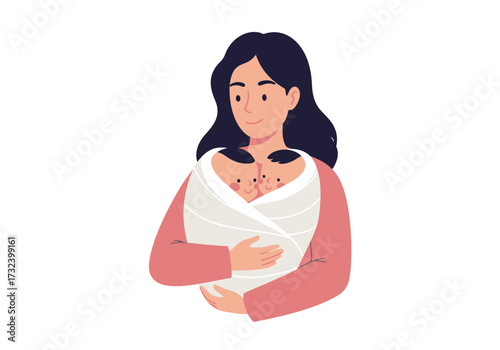 A woman in pink holds twins bundled in a white wrap against a white backdrop