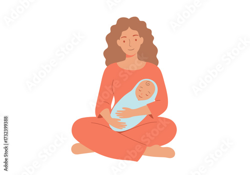 A woman with curly hair sits crosslegged holding a sleeping baby wrapped in a blue blanket