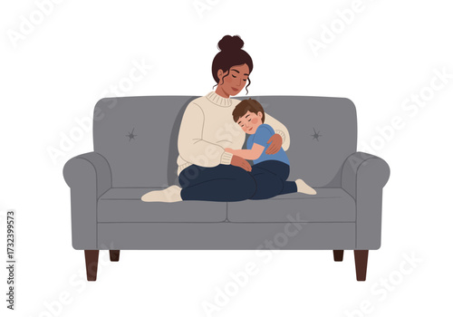 Image depicts a woman embracing a child on a gray couch a scene of affection and comfort