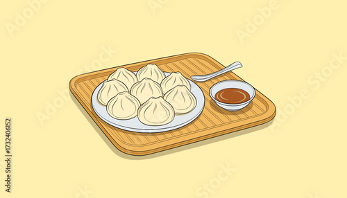 Plate of steamed dumplings with soy sauce on a bamboo tray