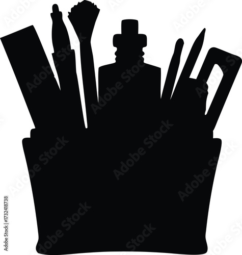 Collection of makeup brushes and tools in a holder silhouette
