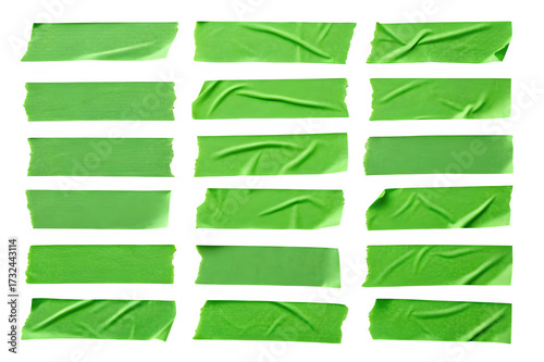 Collection of torn green masking tape strips isolated on transparent background