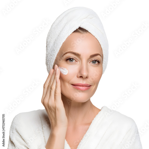 Woman applying skincare cream to her face, white isolated background