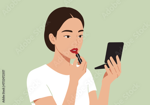 Applying red lipstick home beauty tutorial minimalist background makeup artistry