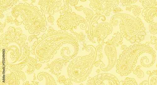 Detailed, repeating paisley pattern in light yellow shades fills the frame