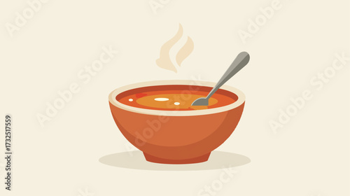 Hot soup in bowl with spoon