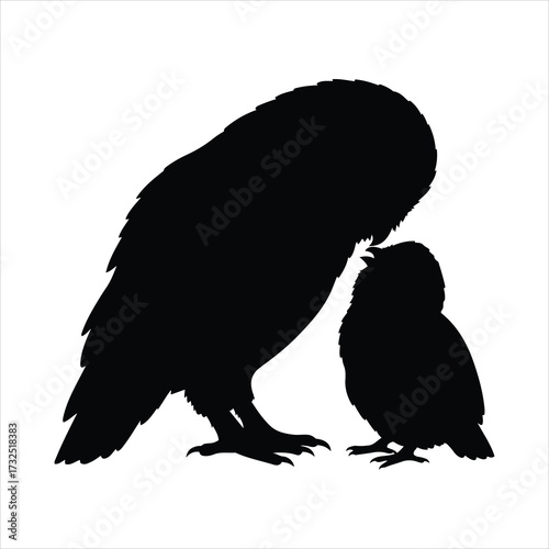 Silhouetted mother owl nurturing her small owlet with gentle tenderness and love