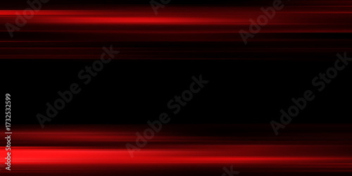 The effect of red light in fast motion on a black background. blurred abstract background with long exposure. neon light
