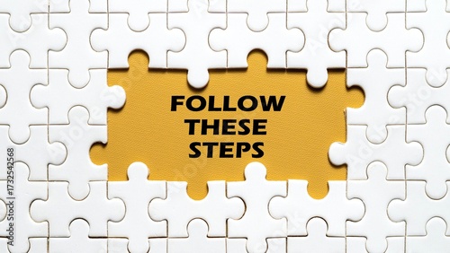 FOLLOW THESE STEPS writing concept in the middle of a puzzle isolated on a yellow background.