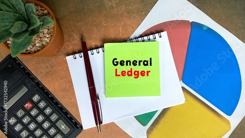 GENERAL LEDGER written on an isolated sticky note on a work desk.