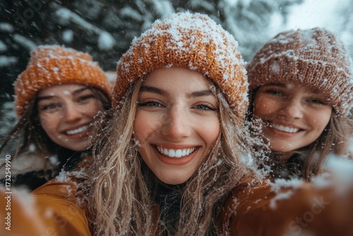 women in winter clothing smiling and laughing.