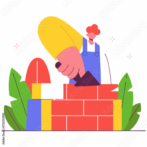 Builder constructing a wall with colorful bricks and tools outdoors  