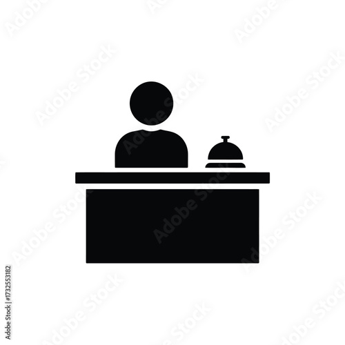 Hotel receptionist at counter with bell icon