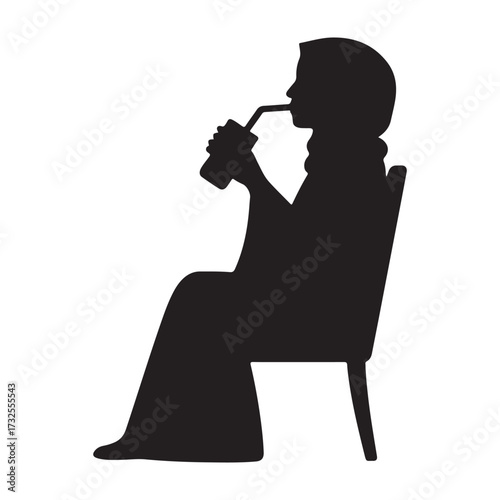 A person wearing a hijab sits in a chair and drinks from a cup with a straw silhouette