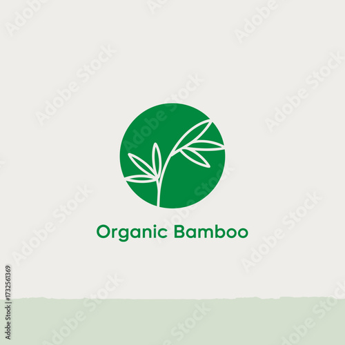 A minimalistic logo design featuring bamboo leaves inside a green circle, representing organic and sustainable living to enhance branding opportunities.