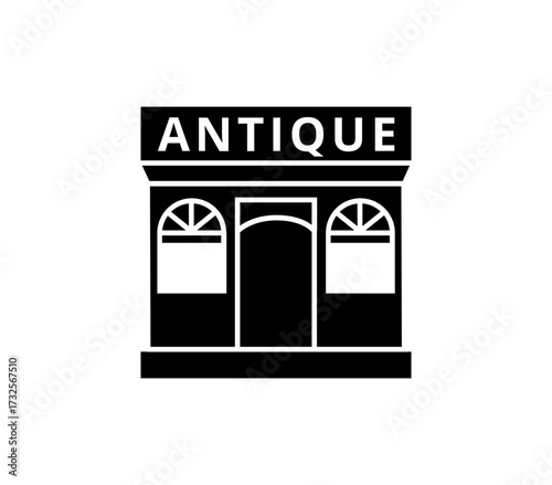 Charming antique shop storefront with classic arched windows and prominent signage evokes nostalgia and timeless style for vintage retail branding