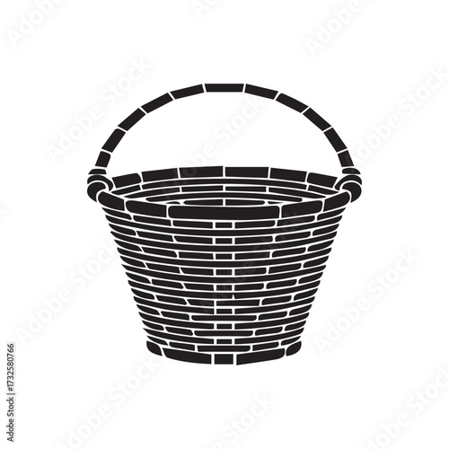Isolated empty brown wicker basket with a handle, a natural woven craft object perfect for Easter, picnic, or shopping