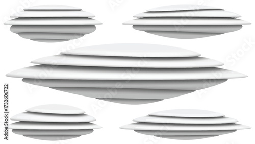 A set of five white, multi-layered, disc-shaped objects resembling flying saucers isolated on a white background.