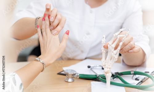 Medical consultation with client in clinic. Doctor rheumatologist diagnostics arthrosis of hands of patient