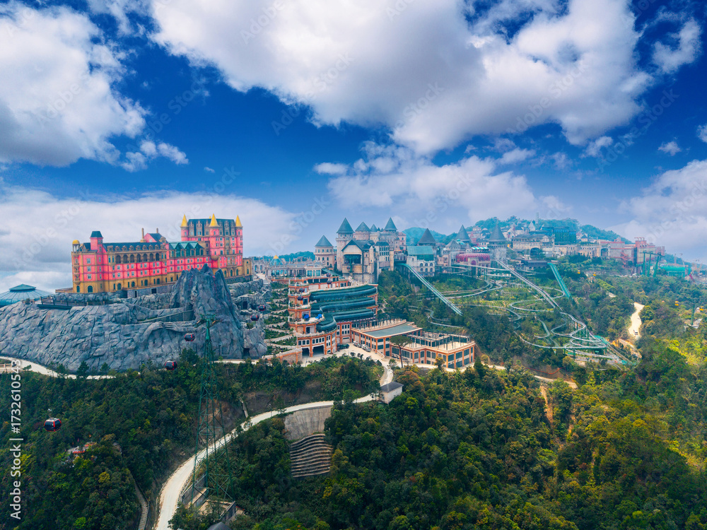 Fototapeta premium Aerial view of ba na hills with vibrant architecture castle and french village in Da nang, Vietnam