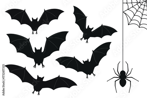 Spooky halloween silhouette of bats and spiderweb with spider