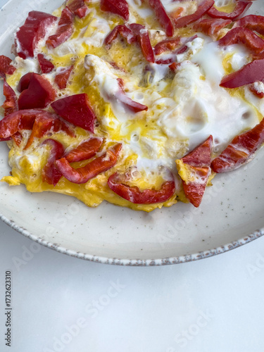 Scrambled Egg with fresh Red Bell Pepper on Plate for breakfast