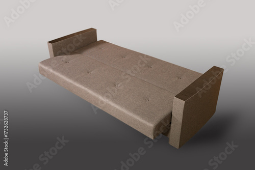 Isolated sofa bed with fabric upholstery on grey gradient background.