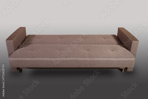 Isolated sofa bed with fabric upholstery on grey gradient background.