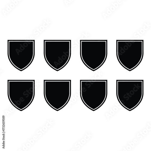 Eight black shield icons geometric shapes empty heraldic emblem symbols abstract design elements silhouette