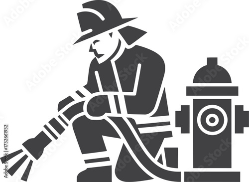 Firefighter in uniform holding a hose next to a fire hydrant
