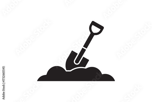 Black shovel digging into the ground