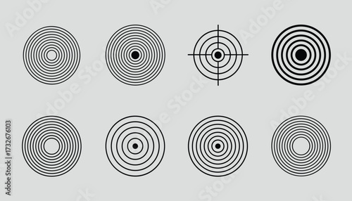 Collection of eight abstract circular target and ripple graphic elements on a plain grey background