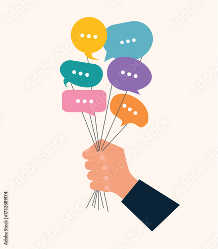 Hand holding speech bubbles. Concept of surveying people. Collecting different opinions