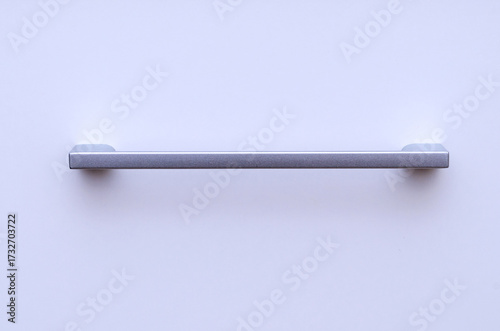 Minimalist Horizontal Silver Handle on a White Cabinet or Drawer