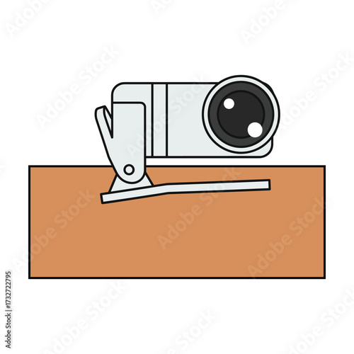 Modern webcam mounted on a wooden desk for video calls and streaming