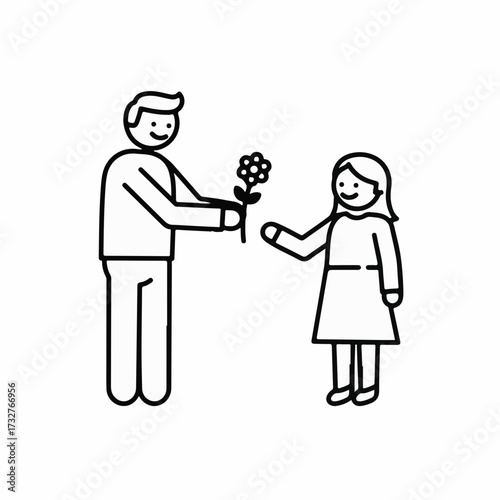 Joyful father gives a flower to his daughter, celebrating love and connection