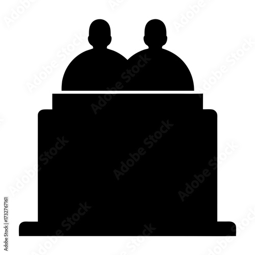 Silhouette of two anonymous people behind a podium, possibly in a court