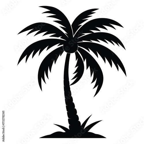 Silhouette of a single palm tree grows on a sandy island in black