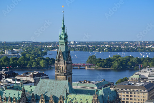 A view of Hamburg’s City Hall with the Binnenalster lake and sailboats in the background