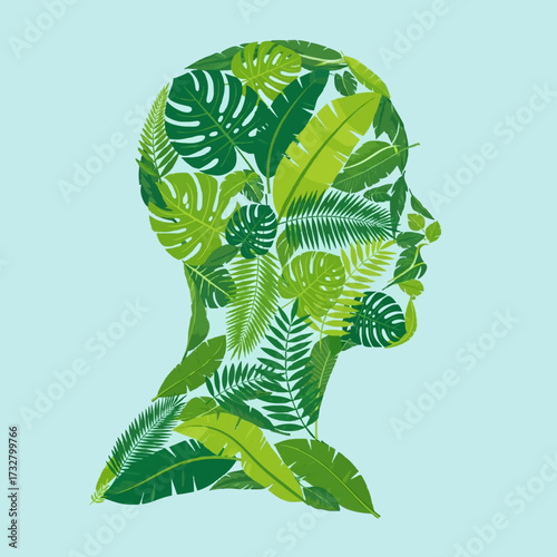 Abstract concept of green thinking and ecological awareness, depicted by a human head silhouette with various leaves