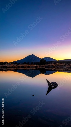 Serene mountain lake at sunrise