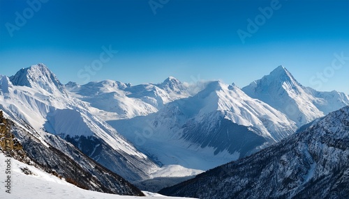 Wallpaper Mural A Vast Pristine Expanse Of Snow Covered Peaks Rises Against A Brilliant Blue Sky Bathed In The Light Of A Serene Winter Day Torontodigital.ca