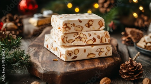 Sweet Spanish Christmas turrón almond nougat on a rustic wooden board with honey glaze and festive decorations. Ideal for recipe books, menu design, and culinary websites or blogs 