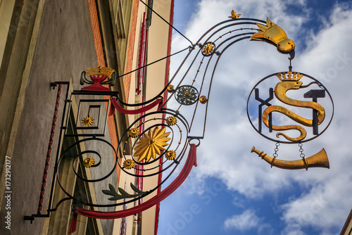 Photography Ornate historic gilded wrought iron medieval guild sign for the smiths guild fea