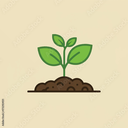 Green seedling sprouting from rich brown soil