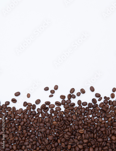 roasted coffee scattered on a white background
