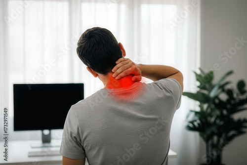 Medical Illnesses and Ailments – Caucasian middle-aged man holding his neck in pain from acute cervical spine discomfort, possibly a sprain