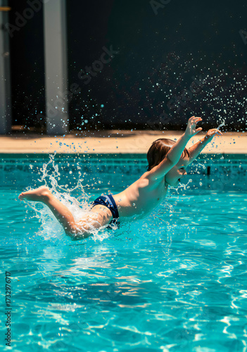 Wallpaper Mural Little Child Diving in Swimming Pool Torontodigital.ca